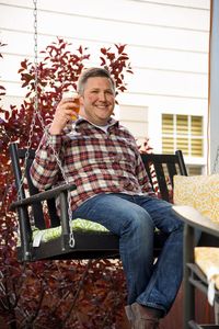 Portrait of smiling young woman sitting outdoors