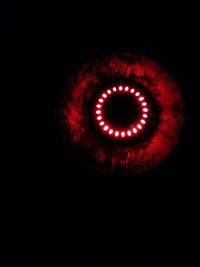Close-up of red object over black background