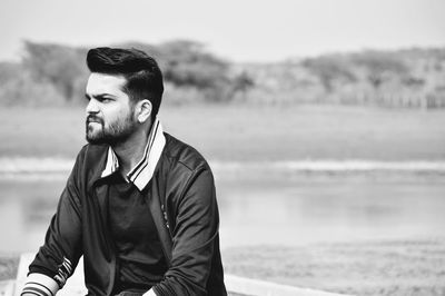 Portrait of young man looking away