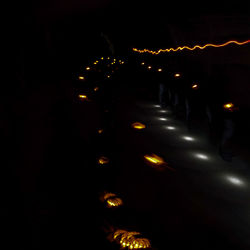 High angle view of illuminated lights at night