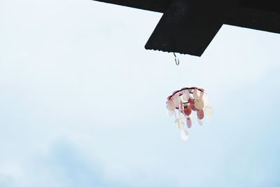 Low angle view of kite hanging from roof