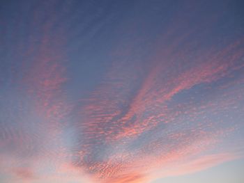 Low angle view of clouds in sky during sunset