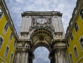 Low angle view of historical building against sky arch of praça do comércio lisboa portugal