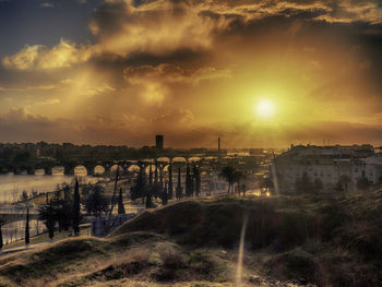 Scenic view of river against sky during sunset