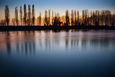 Incredible sunset on the muzza river with beautiful lights, colors and reflections