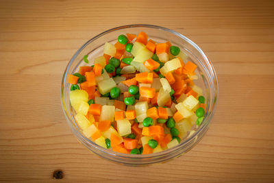 High angle view of chopped vegetables in bowl on table