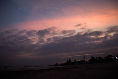 Scenic view of beach against sky during sunset