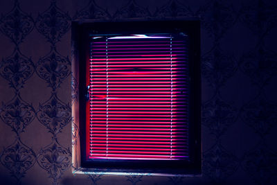 Window with blinds in the dark room