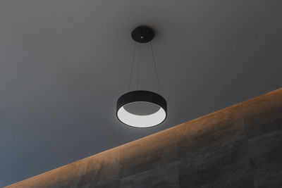 Low angle view of pendant light hanging from ceiling