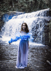 Woman wearing mask in forest