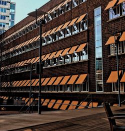 Low angle view of building in city against sky