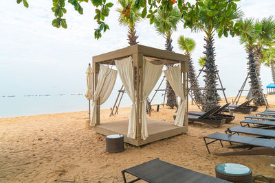 Built structure on beach against sky