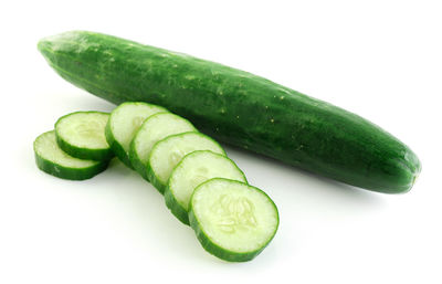 Close-up of green chili pepper against white background