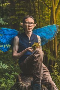 Portrait of a young guy with wings