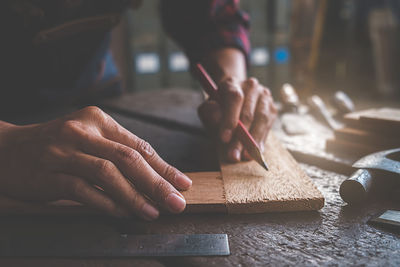 Midsection of person working on table