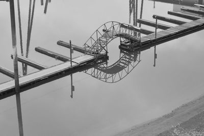 Low angle view of rollercoaster against sky