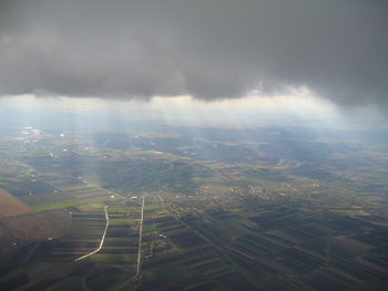 Aerial view of agricultural field against sky