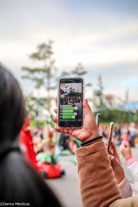 Man photographing on mobile phone