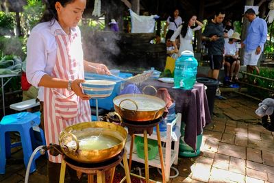 People standing at market stall