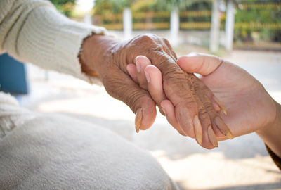 Close-up of man holding hands
