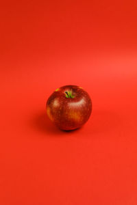 High angle view of apple against yellow background
