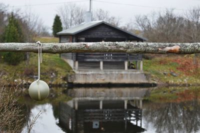 Gazebo by lake against building