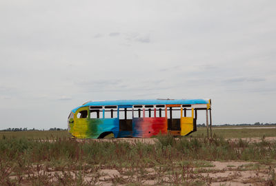 Train on field against sky