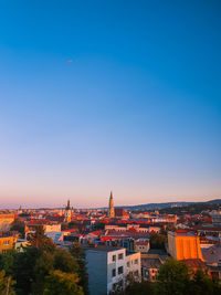 High angle view of townscape against clear blue sky