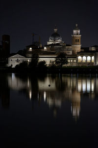 Reflection of illuminated buildings in city at night