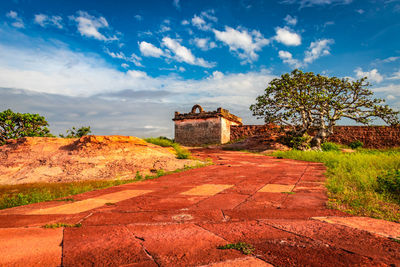 View of old building against cloudy sky