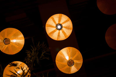 Low angle view of illuminated lantern hanging from ceiling