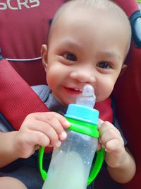 Portrait of cute boy drinking