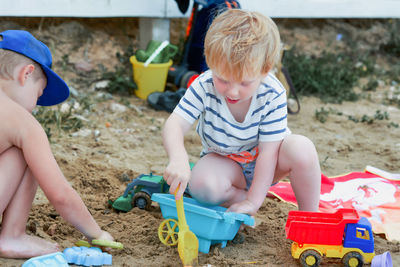 High angle view of boy playing with toys