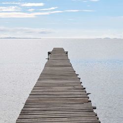 Pier on sea against sky