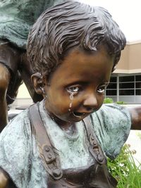 Close-up portrait of boy statue