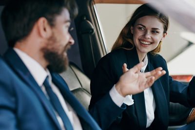 Business people having discussion in car