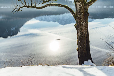 Scenic view of snow covered field against sky