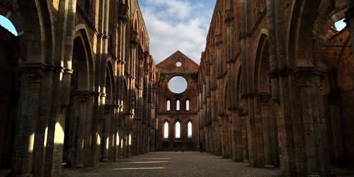 Archway of historic building against sky