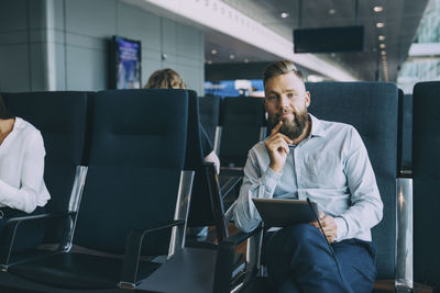 People sitting on chair in office