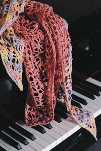 Textile hanging on piano