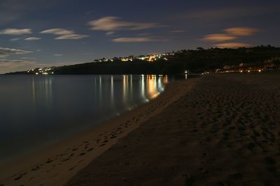 Scenic view of sea against sky at night