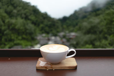 Close-up of coffee cup on table