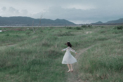 Woman standing on field