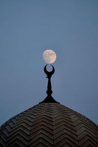 Low angle view of building against blue sky