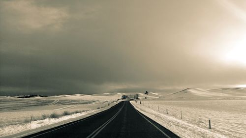 Road against sky during winter