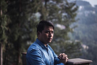 Portrait of young man looking away