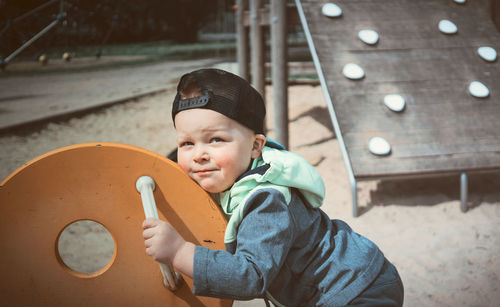 Portrait of cute boy at playground