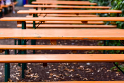 Close-up of empty bench in row