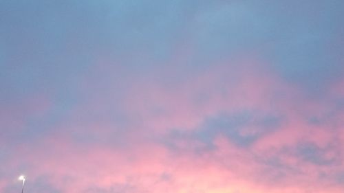 Low angle view of dramatic sky during sunset