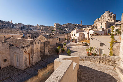 Old buildings in city against clear sky